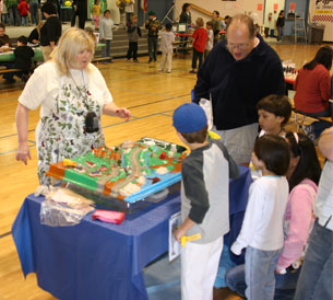 Photo of Jill Falcone demonstrating how pollution run-off occurs